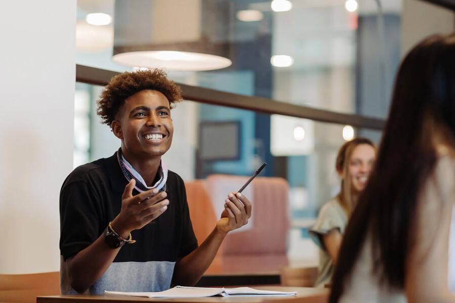 Education student engages in classroom discussion.